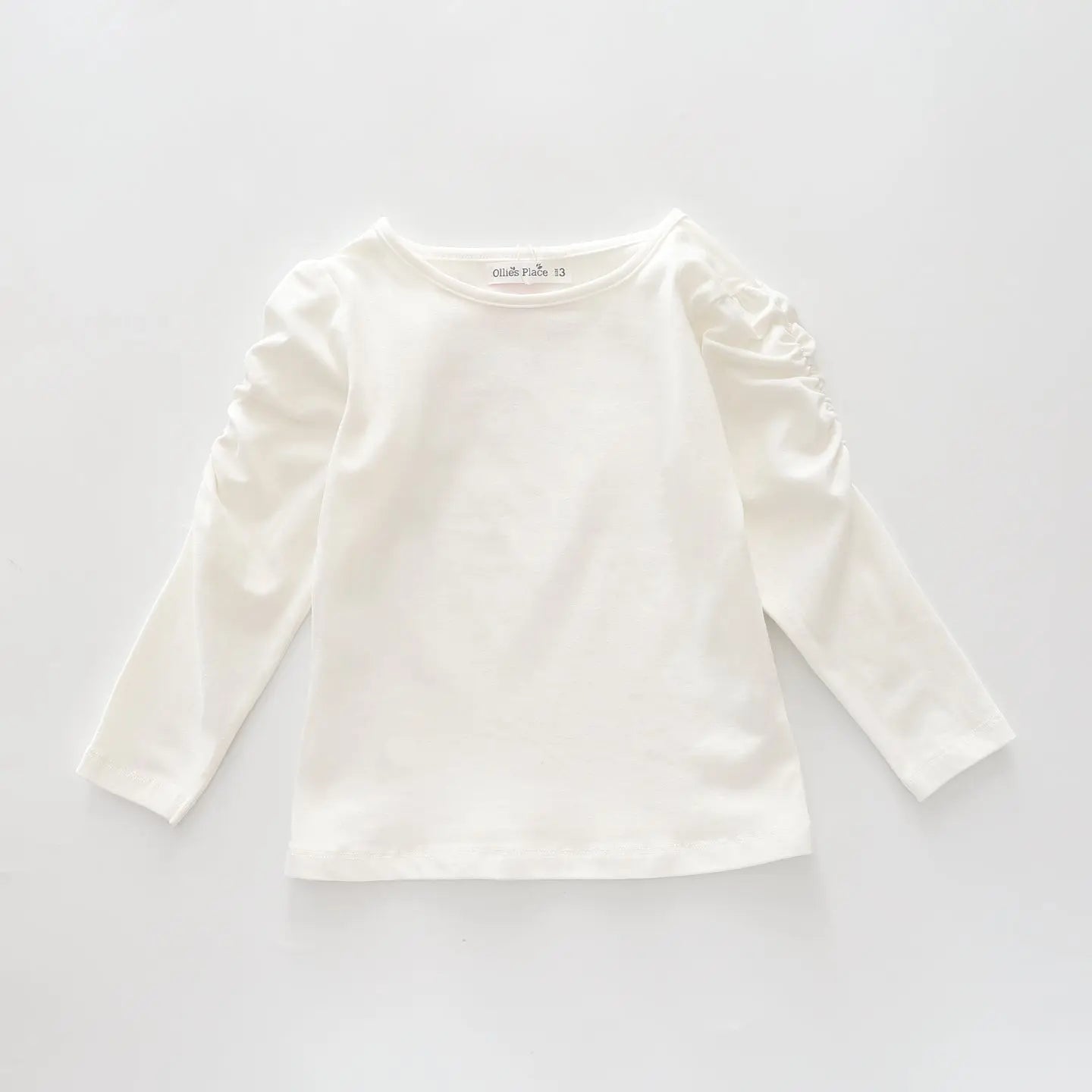 Classic Long Sleeve Ivory Tee With Scoop Neck And Ruching Sleeve Details Ollies Place
