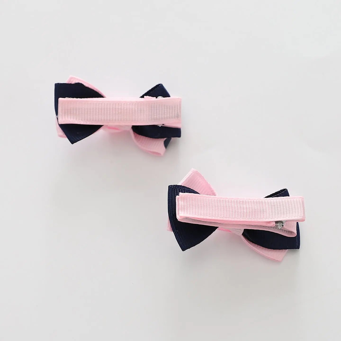 Pink and Navy Polka Dot Bow Hair Clips 2 Pack Ollies Place
